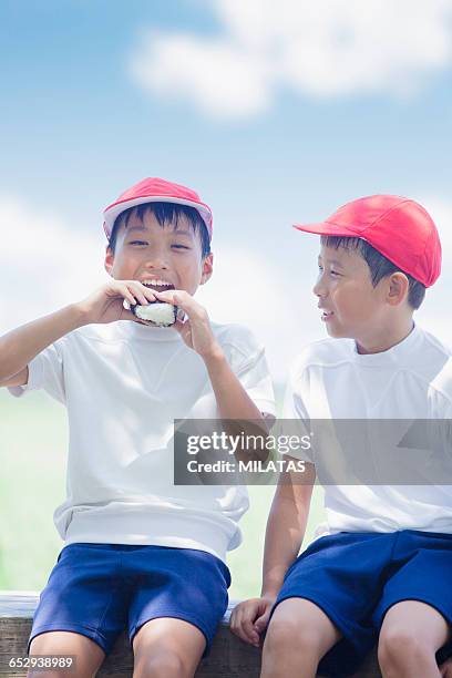 japanese elementary school students to eat rice balls - rice ball stock pictures, royalty-free photos & images
