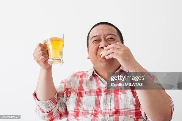 take a meal middle-aged of japanese men - beer belly - fotografias e filmes do acervo