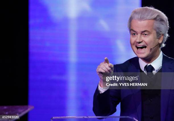 Netherlands' far-right politician Geert Wilders of the PVV party reacts during a debate with Netherlands' prime minister Mark Rutte of the VVD...