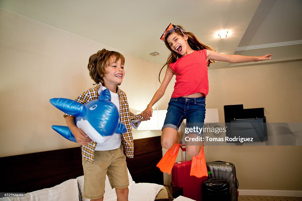 Brother And Sister Playing In Hotel Room HighRes Stock Photo Getty