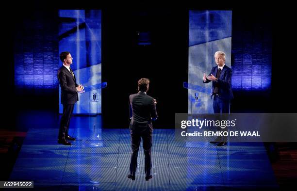 Netherlands' far-right politician Geert Wilders of the PVV party gestures while during a debate with Netherlands' prime minister Mark Rutte of the...