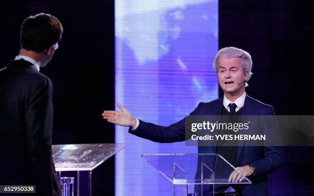 Netherlands' far-right politician Geert Wilders of the PVV party gestures during a debate with Netherlands' prime minister Mark Rutte of the VVD...