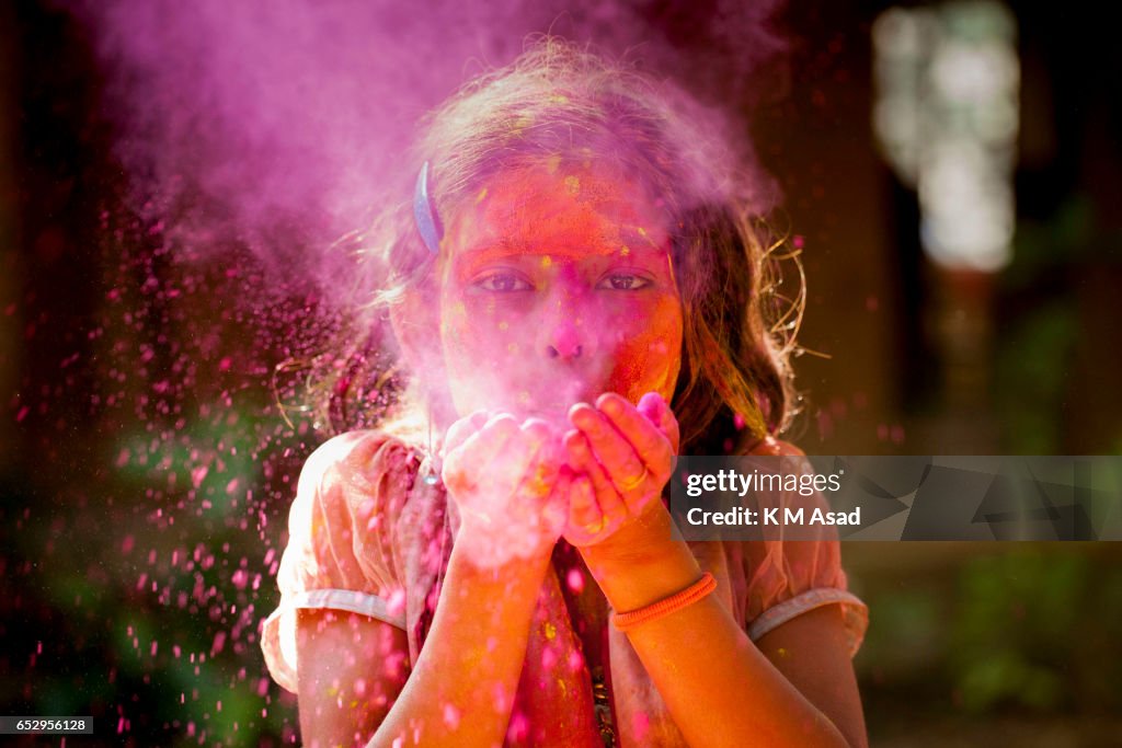 A street girl attend celebrate the Holi Festival or Festival...