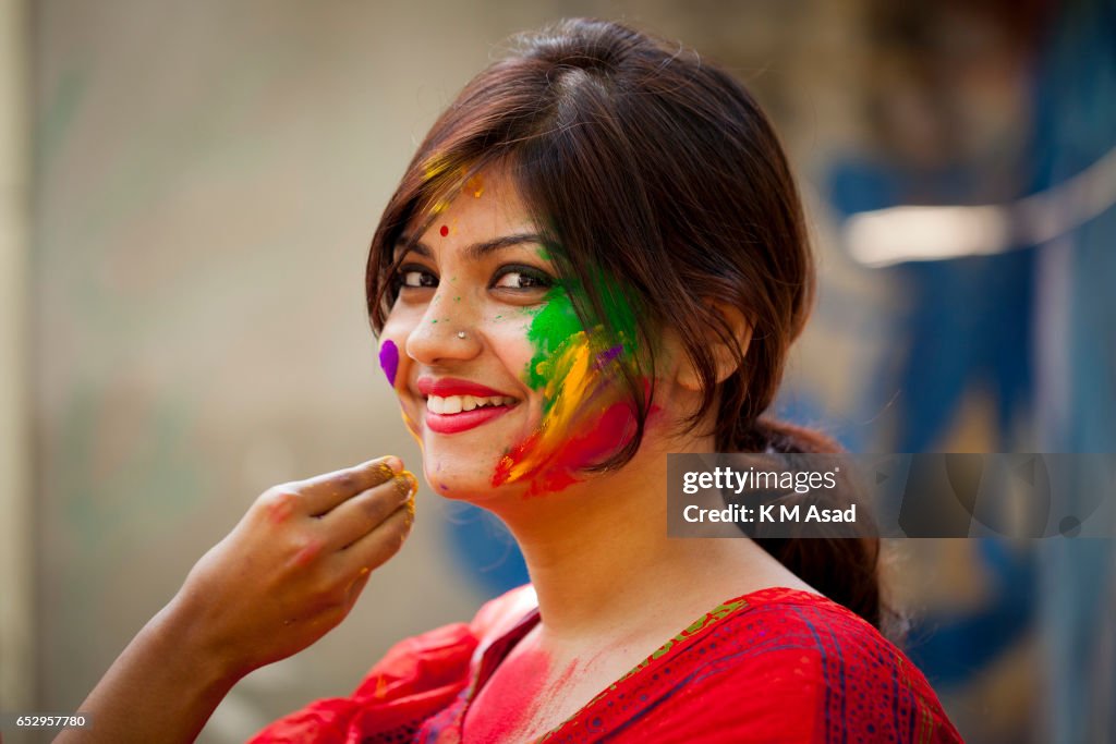 Portrait of a young lady celebrate the Holi Festival or...