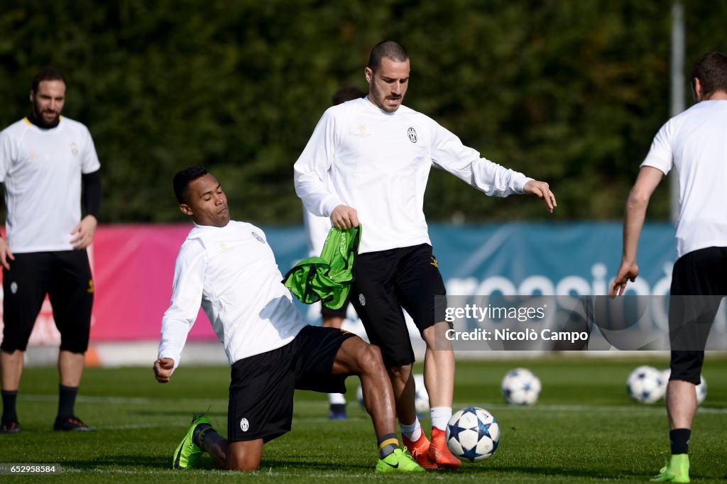 Alex Sandro and Leonardo Bonucci compete for the ball during...