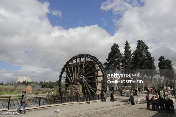 Picture shows one of the ancient water wheels, or norias, along the Orontes River in Hama in central Syria, on March 13, 2017.