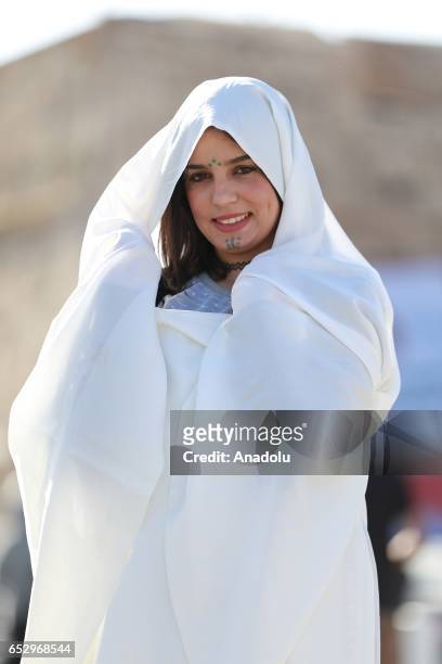 Libyan woman wearing traditional clothes attends an event to mark the "National Day of Traditional Dress" at es-Suheda Square in Tripoli, Libya on...