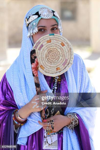 Libyan woman wearing traditional clothes attends an event to mark the "National Day of Traditional Dress" at es-Suheda Square in Tripoli, Libya on...