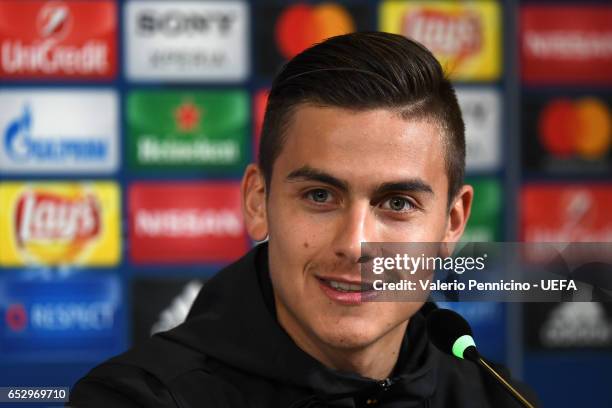 Paulo Dybala of Juventus FC faces the media during a press conference ahead of the UEFA Champions League Round of 16 second leg match between...