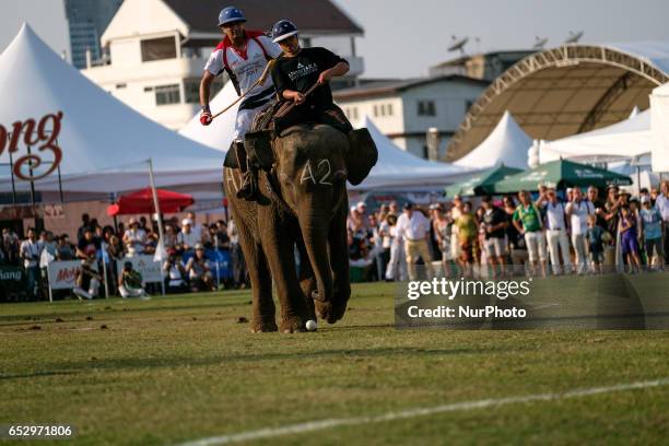 Polo player rides an elephant during the 2017 King's Cup Elephant Polo tournament at Anantara Chaopraya Resort in Bangkok, Thailand on March 12,...