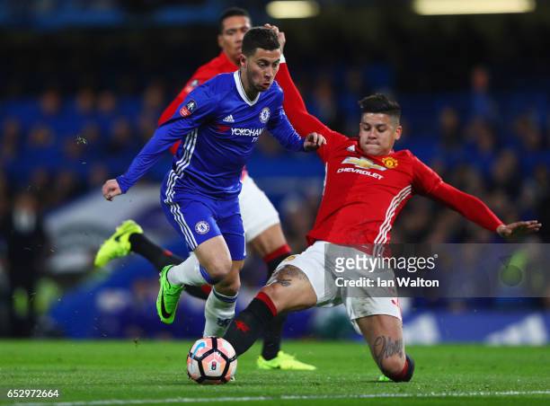 Eden Hazard of Chelsea takes on Marcos Rojo of Manchester United during The Emirates FA Cup Quarter-Final match between Chelsea and Manchester United...
