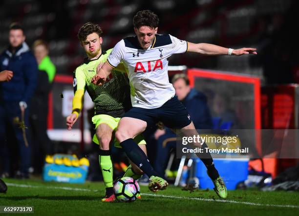 Ryan Loft of Tottenham Hotspur is tackled by Tyler Frost of Reading during the Premier League 2 match between Tottenham Hotspur and Reading at The...