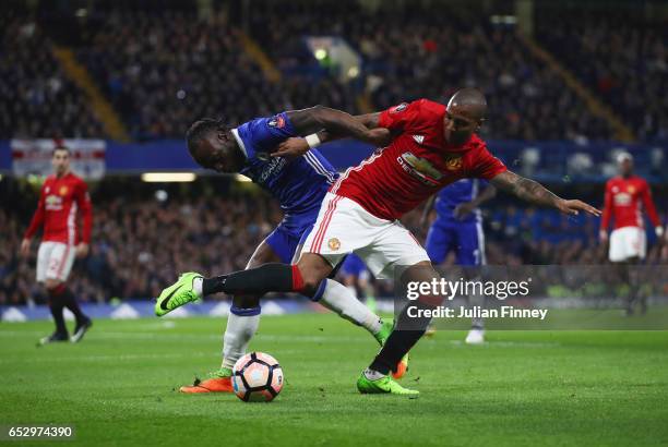 Victor Moses of Chelsea and Ashley Young of Manchester United battle for the ball during The Emirates FA Cup Quarter-Final match between Chelsea and...