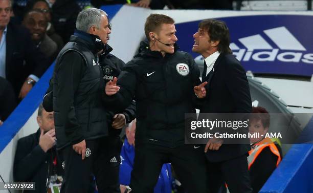 Jose Mourinho Manager of Manchester United and Antonio Conte manager of Chelsea have words and are separated by fourth official Mike Jones during The...