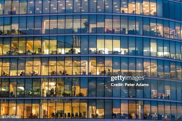 people working in offices, facade & windows, london, uk - city lights night business stock pictures, royalty-free photos & images