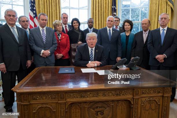 President Donald Trump delivers brief remarks before signing an executive order entitled, 'Comprehensive Plan for Reorganizing the Executive Branch',...