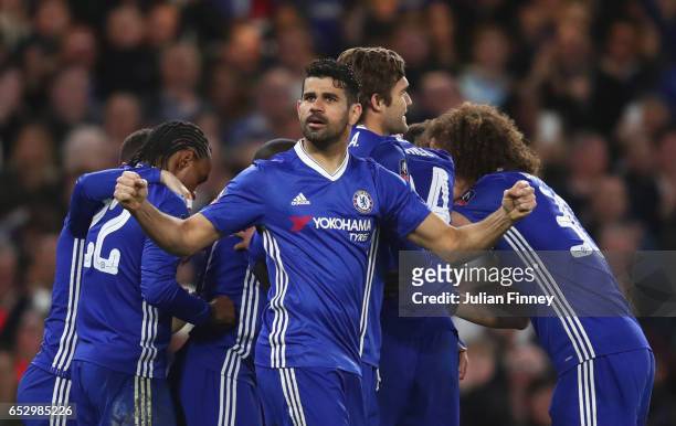 Diego Costa of Chelsea and team mates celebrate as N'Golo Kante of Chelsea scores their first goal during The Emirates FA Cup Quarter-Final match...