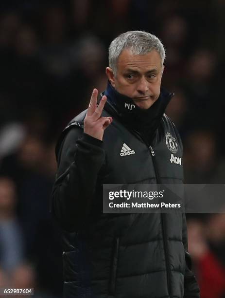 Manager Jose Mourinho of Manchester United holds up three fingers during the Emirates FA Cup Quarter-Final match between Chelsea and Manchester...