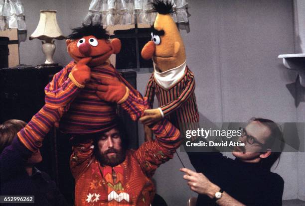 Puppeteers (L-R: Daniel Seagren holding and Jim Henson working Ernie and Frank Oz with Bert rehearse for an episode of Sesame Street at Reeves...