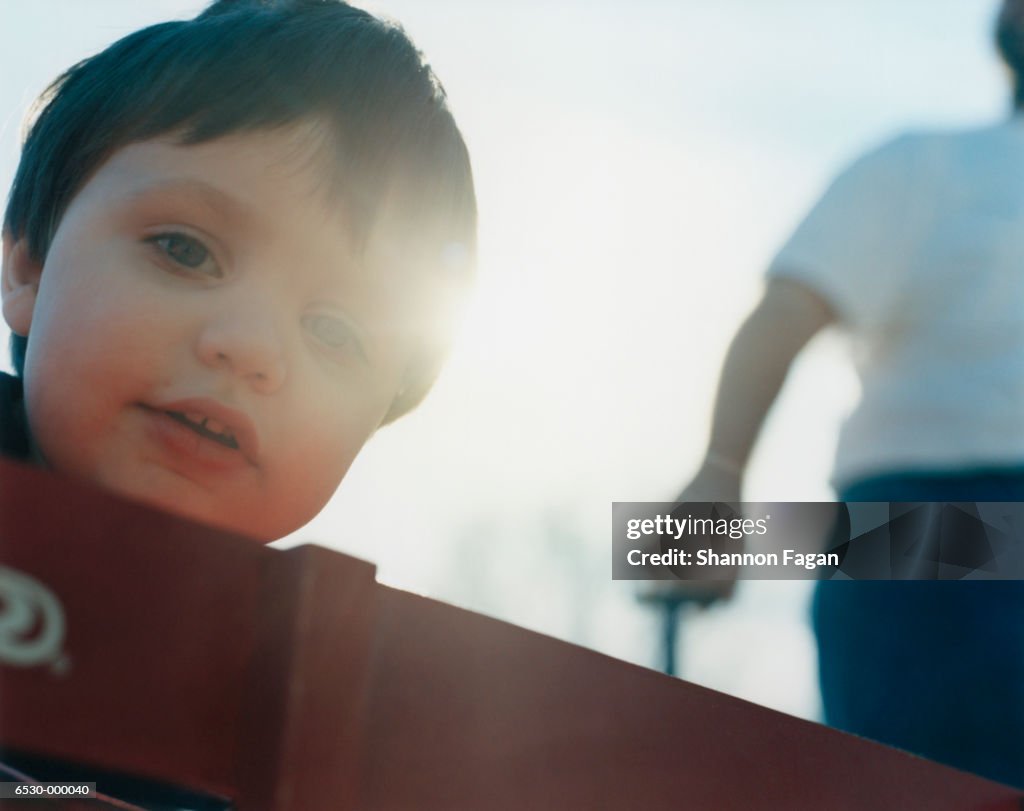 Boy Being Pulled in Handcart