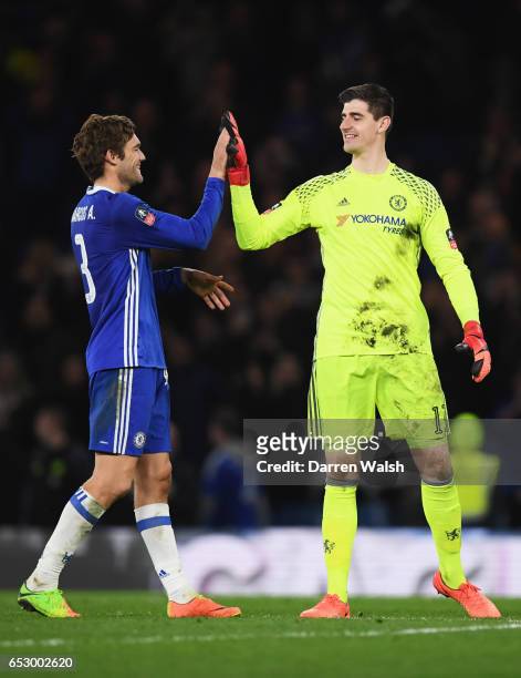 Thibaut Courtois of Chelsea celebrates victory with Marcos Alonso of Chelsea after The Emirates FA Cup Quarter-Final match between Chelsea and...