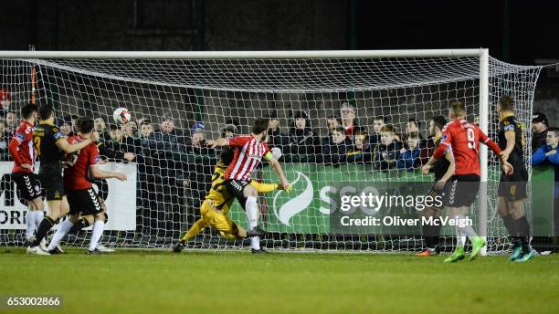 Donegal , Ireland - 13 March 2017; Ryan McBride of Derry City scores his side's third goal despite the challenge of Gabriel Sava of Dundalk during...