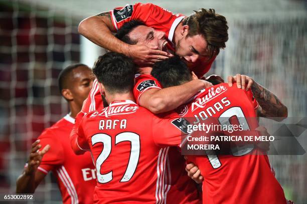 Benfica's Brazilian forward Jonas Oliveira celebrates a goal with teammates during the Portuguese league football match SL Benfica vs OS Belenenses...