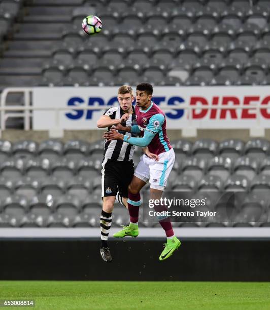 Stuart Findlay of Newcastle United and Marcus Browne of West Ham United jostle to win the ball during the Premier League 2 Match between Newcastle...