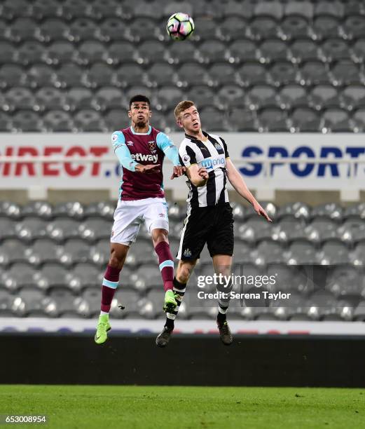 Stuart Findlay of Newcastle United and Marcus Browne of West Ham United jostle to win the ball during the Premier League 2 Match between Newcastle...