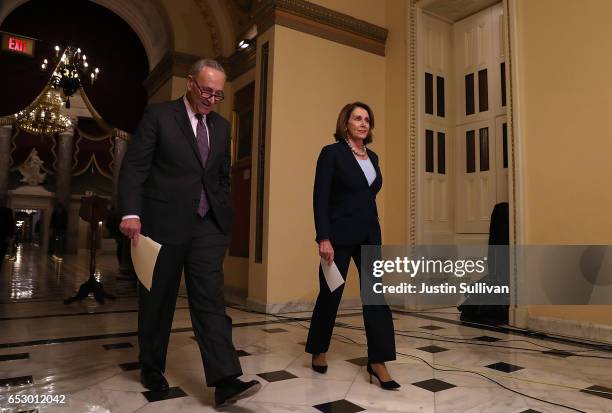 Senate Minority Leader Charles Schumer and House Minority Leader Nancy Pelosi prepare to speak to reporters during a news conference at the U.S....