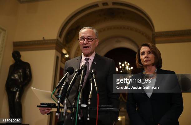 Senate Minority Leader Charles Schumer speaks as House Minority Leader Nancy Pelosi looks on during a news conference at the U.S. Capitol on March...