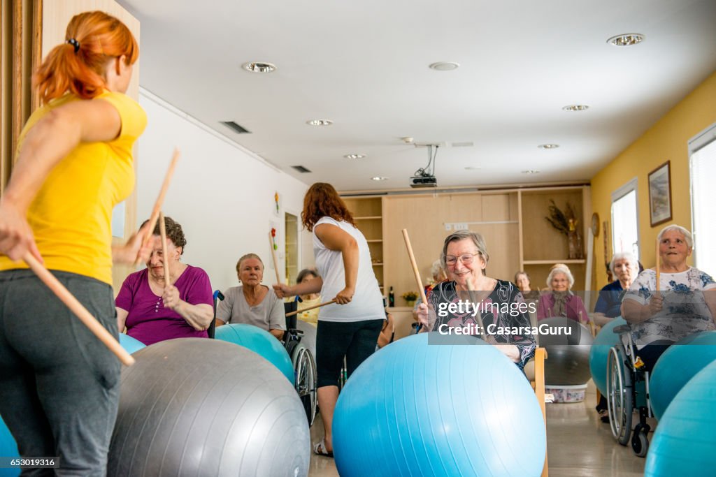 Seniors In The Retirement Home Having Group Therapy