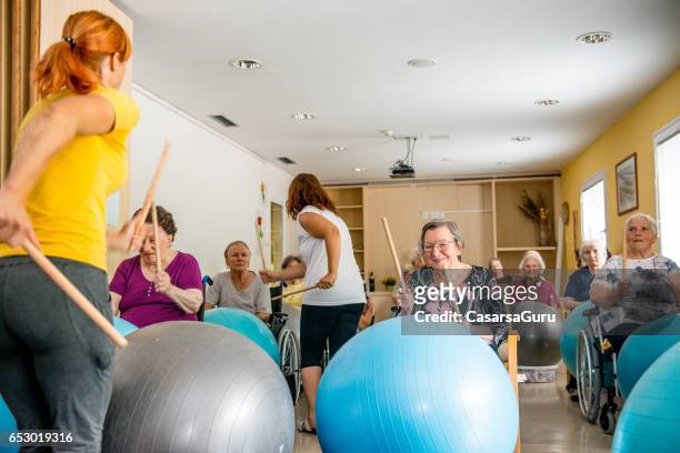 seniors in the retirement home having group therapy - activities stock pictures, royalty-free photos & images