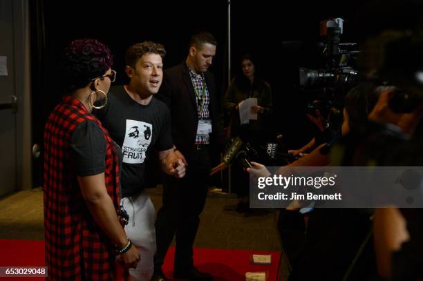 Mike Brown's mother Lesley McSpadden and director Jason Pollock are interviewed at the red carpet premier of the documentary Stranger Fruit during...