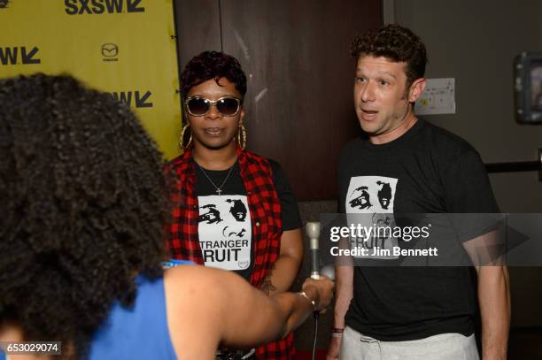 Mike Brown's mother Lesley McSpadden and director Jason Pollock are interviewed at the red carpet premier of the documentary Stranger Fruit during...