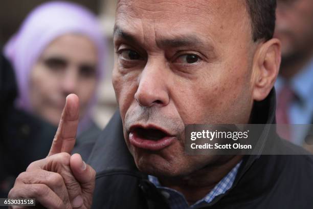 Rep. Luis Gutierrez speaks to the press after leaving the office of Immigration Services where he was briefly handcuffed and detained after refusing...