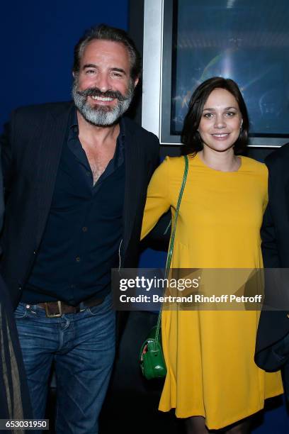 Jean Dujardin and Nathalie Pechalat attend the "Chacun sa vie" Paris Premiere at Cinema UGC Normandie on March 13, 2017 in Paris, France.