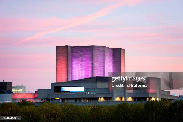 illuminated view of the royal national theatre in london eye at twilight - royal national theater stock pictures, royalty-free photos & images