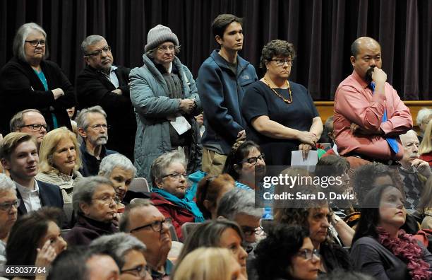 Rep. David Price constituents line up to ask the Representative questions during a town hall meeting at Broughton High School on March 13, 2017 in...