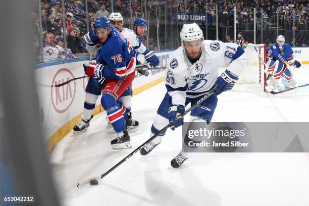 Gabriel Dumont of the Tampa Bay Lightning skates with the puck against Brady Skjei of the New York Rangers at Madison Square Garden on March 13, 2017...