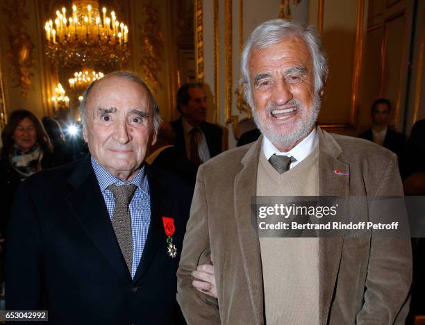 Claude Brasseur and Jean-Paul Belmondo attend Claude Brasseur is elevated to the rank of "Officier de la Legion d'Honneur" at Elysee Palace on March...