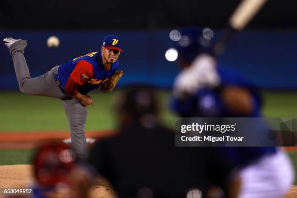 Omar Bencomo of Venezuela pitches in the bottom of the first inning during the World Baseball Classic Pool D Game 7 between Venezuela and Italy at...