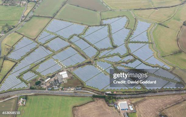 Aerial view of a large solar farm in Gloucestershire on February 07, 2017. Four miles west of stroud, next to the river Cam lies the 30MWp solar...