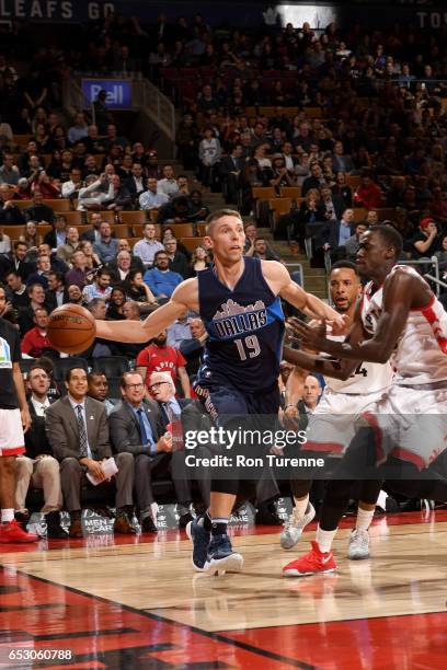 Jarrod Uthoff of the Dallas Mavericks passes the ball against the Toronto Raptors on March 13, 2017 at the Air Canada Centre in Toronto, Ontario,...