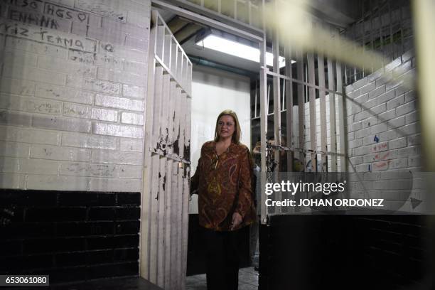 Former Social Welfare Deputy Secretary Anahi Keller is seen in a court cell after being arrested in connection with the fire at a children's shelter...