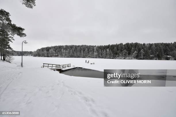 Johanna Nordblad Finnish freediver and her sister Elina, make a hole in a frozen lake in order to train Ice-freediving on February 27 in Somero . The...