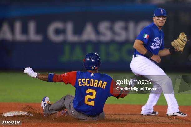 Alcides Escobar of Venezuela slides into second in the top of the sixth inning during the World Baseball Classic Pool D Game 7 between Venezuela and...