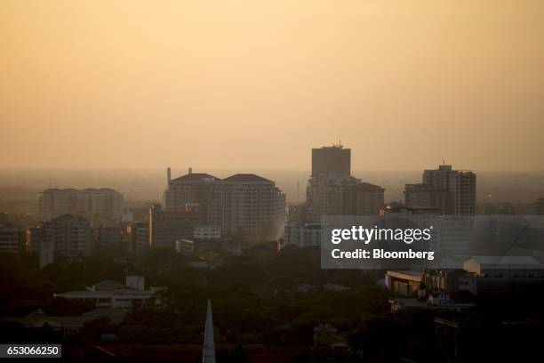 Residential buildings stand in Yangon, Myanmar, on Saturday, March 11, 2017. Myanmar is considering changes to the companies law that would allow...