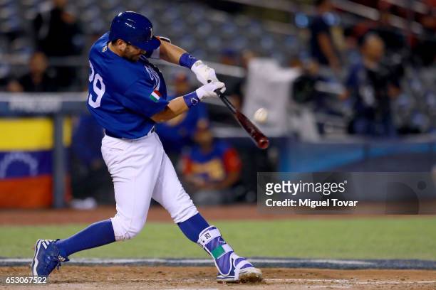 Francisco Cervelli of Italy hits the ball in the bottom of the fifth inning during the World Baseball Classic Pool D Game 7 between Venezuela and...
