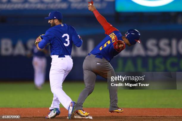 Carlos Gonzalez of Venezuela slides into second in the top of the sixth inning during the World Baseball Classic Pool D Game 7 between Venezuela and...